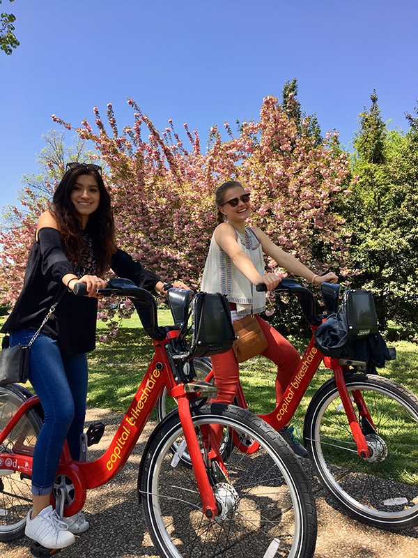 Emma Ernst '19 and Sofia Stechina '19 biking in Washington, D.C.